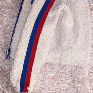 White Sherpa with Blue and Red Design.